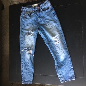 Garage ripped blue jeans